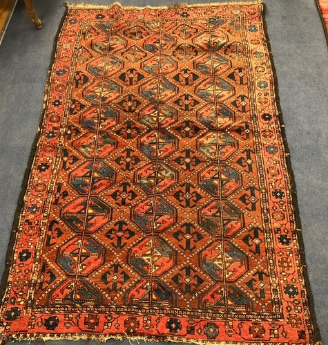 A Bokhara red ground rug 200 x 124cm
